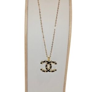 CHANEL Gold and Black Pendant Necklace